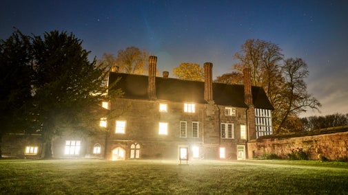 Warm light shining through the windows at Coventry Charterhouse